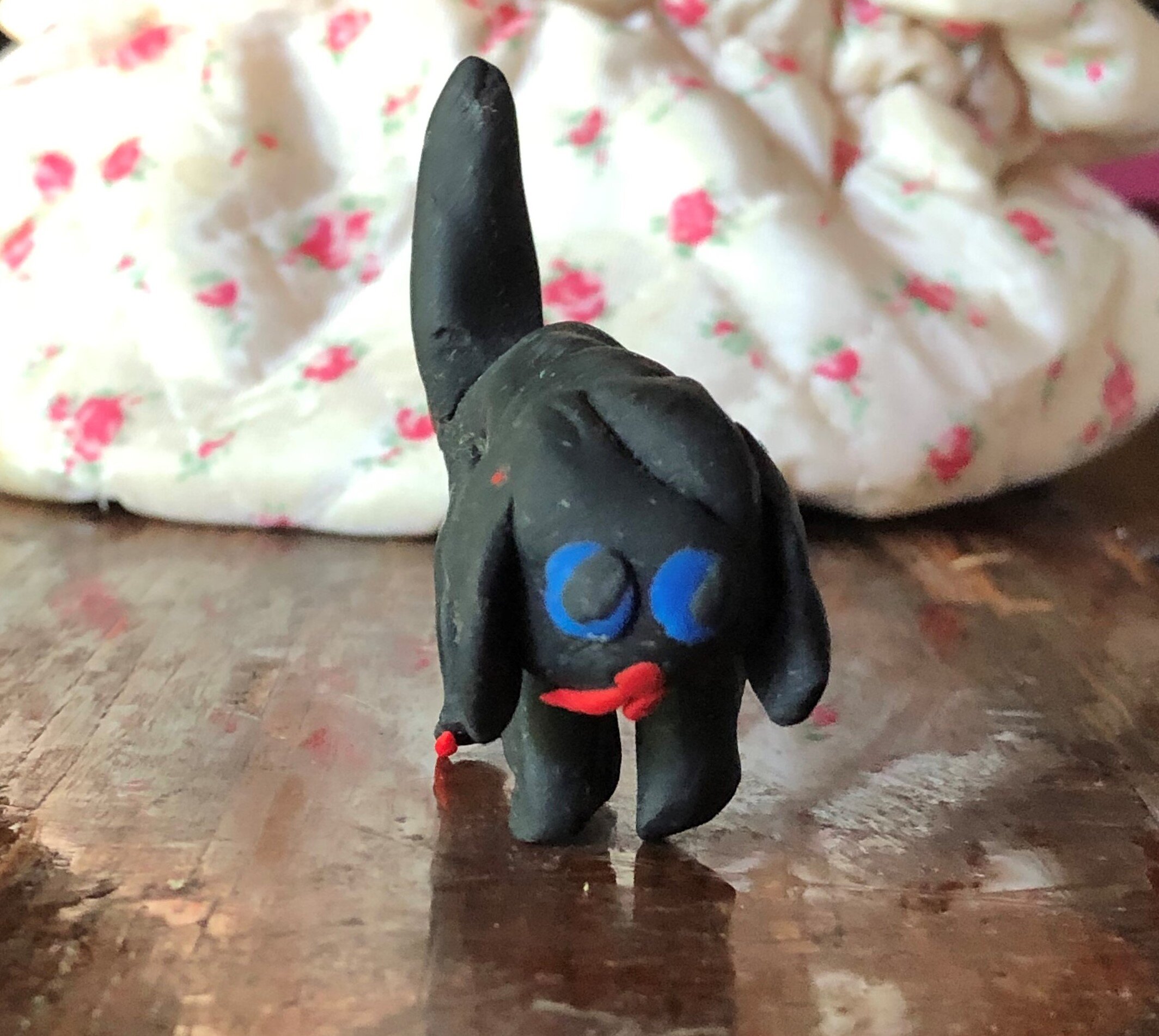 Small black clay dog