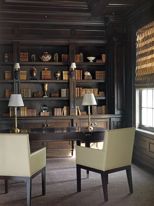 The Georgian-styled, Canadian summer home we created for this Florida-based couple reflects a lifestyle with very young children, a dog and a busy social calendar. We designed the study library as a quiet, sober retreat with its rich, dark colours and traditionally detailed bookcases and wall panelling contrasting with the spare elegance of the Lucien Rollin Art Deco desk and simple leather chairs.