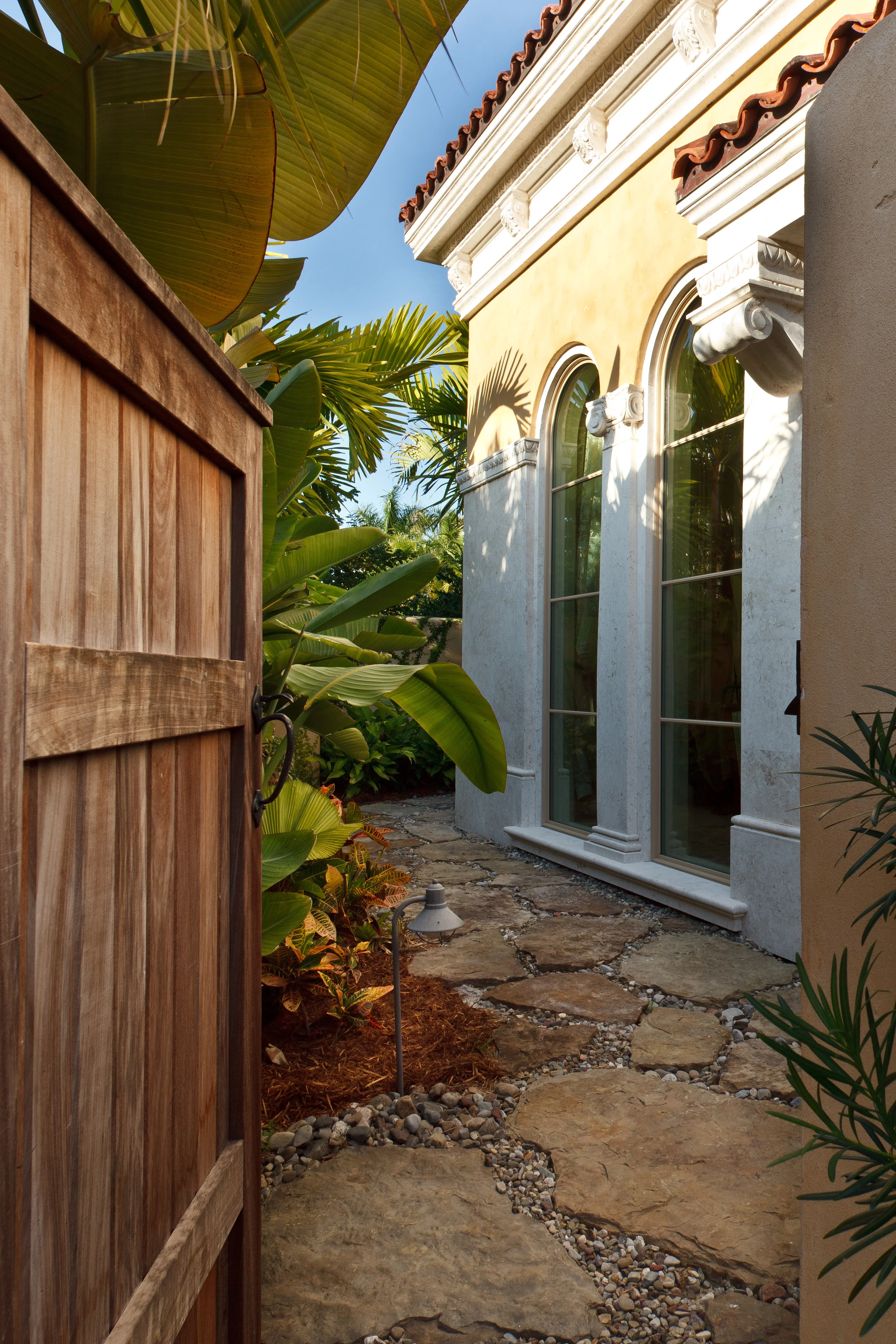 A private path past the master bath leads to a concealed courtyard with an outdoor shower. Inside the huge copper tub is placed to take advantage of the private landscape view.
