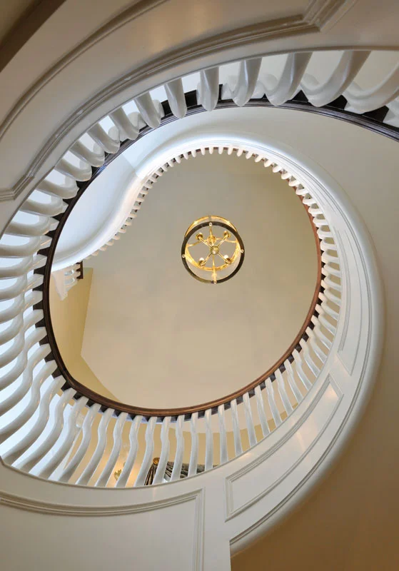 We designed this classic, spacious and comfortable “farmhouse”, situated on rolling acres of farm and woodland in Upper New York State, to serve the family for years to come. This remarkable sculptural staircase exemplifies the exquisite detailing throughout.