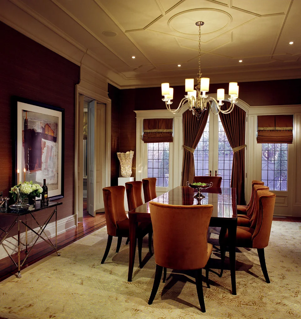 The Chippendale inspired ceiling and millwork details subtly contrast with the contemporary mid-century furnishings.