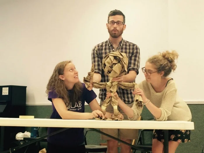 Me demonstrating the puppeteering positions for a master class with CO/LAB Theater Group