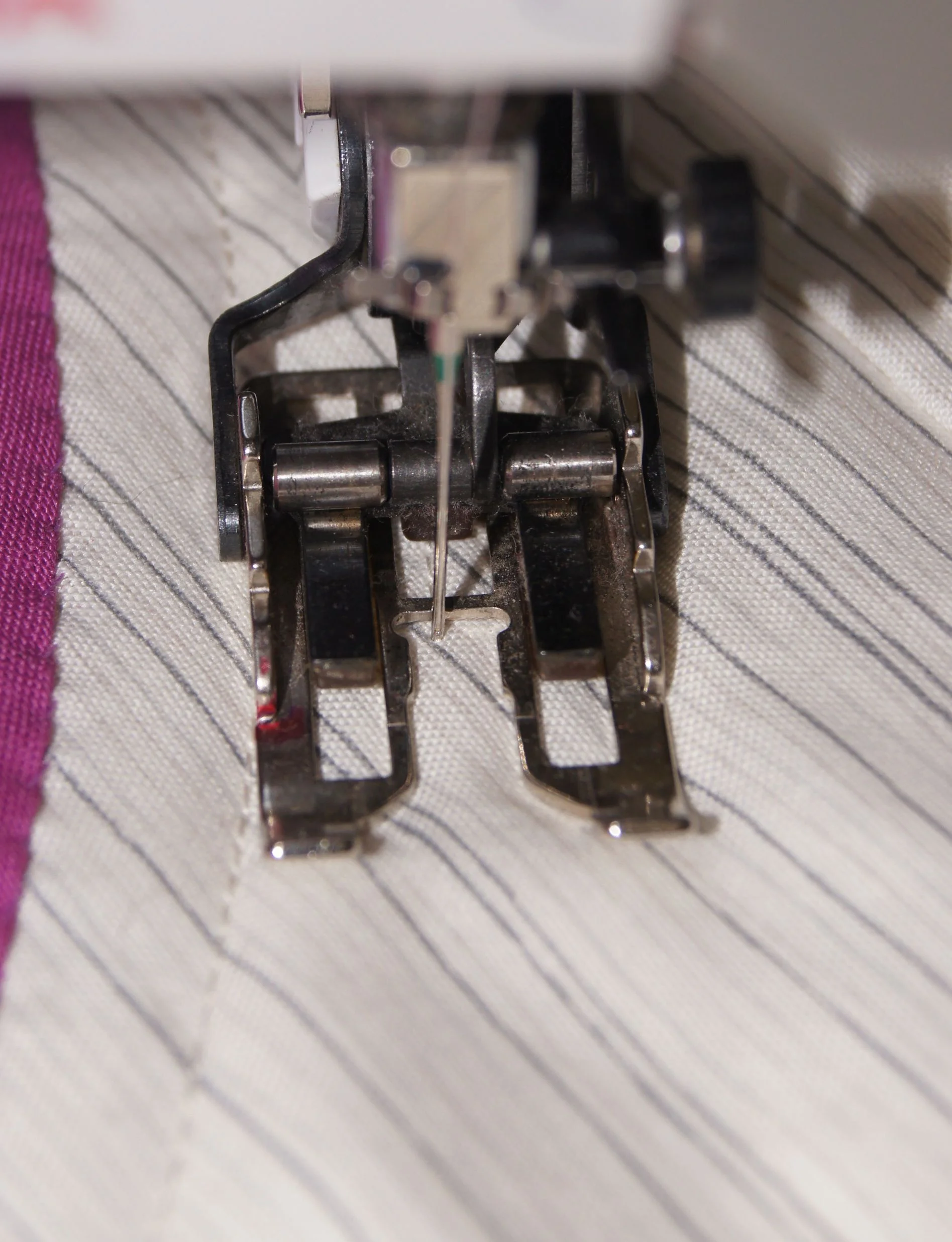 Red mark on the left edge of walking foot.