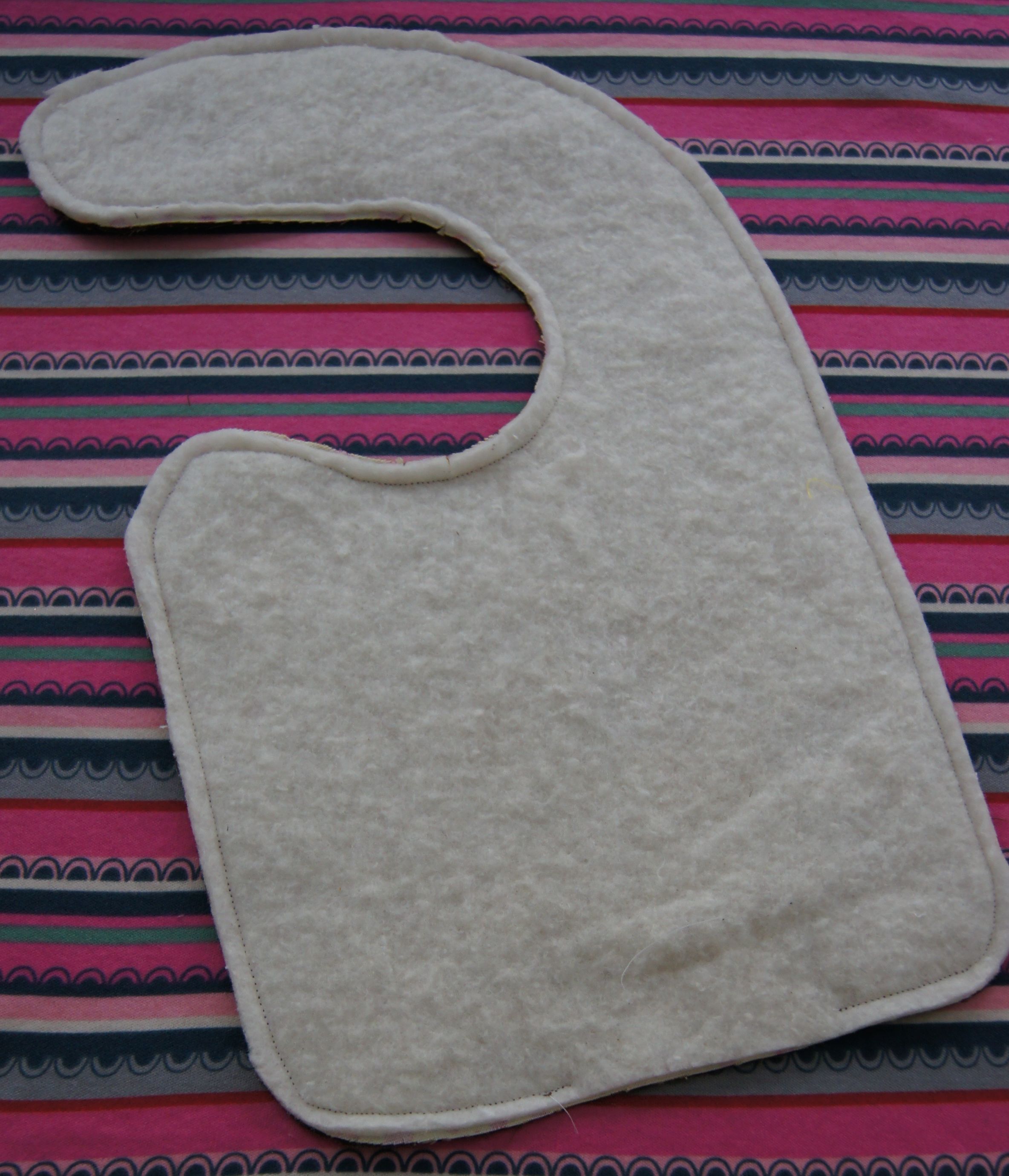 Quilt batting used as the absorbent middle layer of a bib