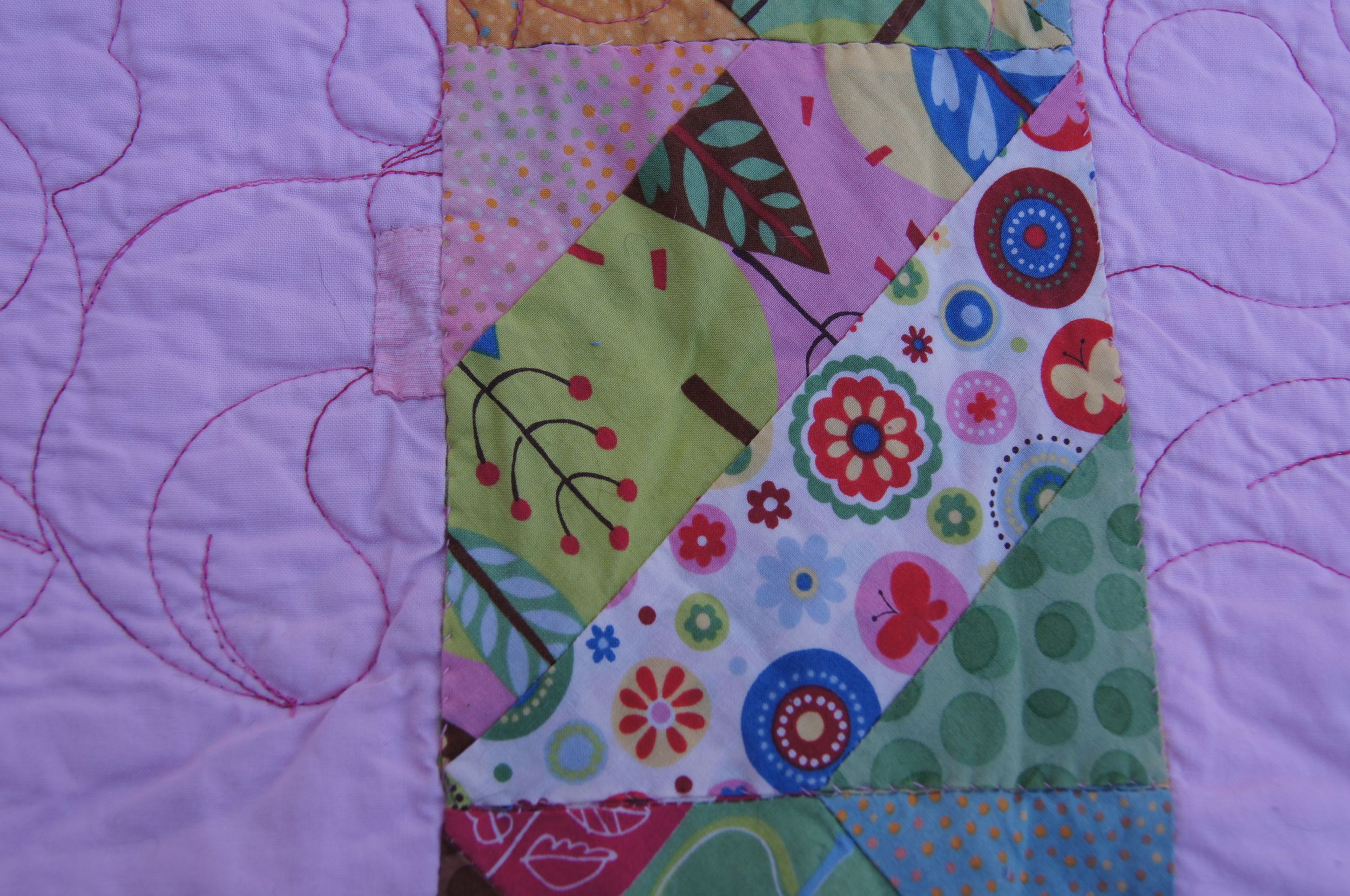 Mending on the back of Cats in Trees Quilt