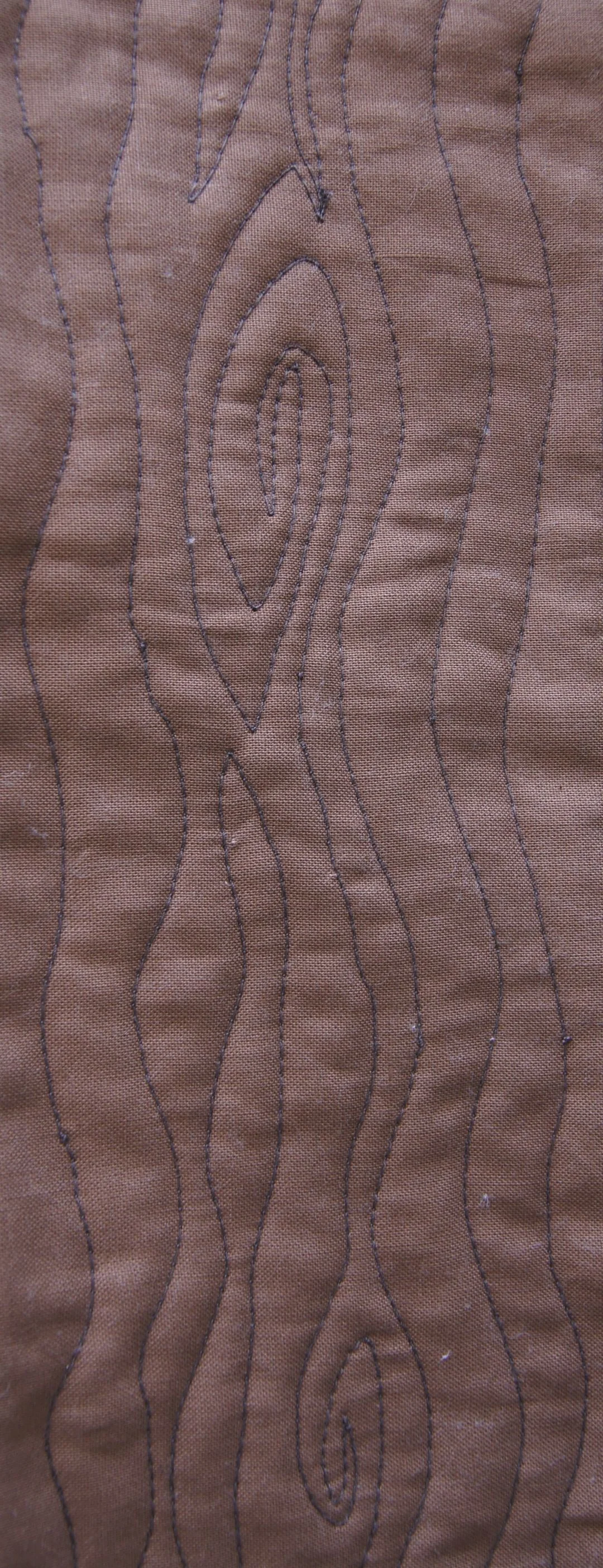 Quilting a wood grain pattern with free-motion quilting