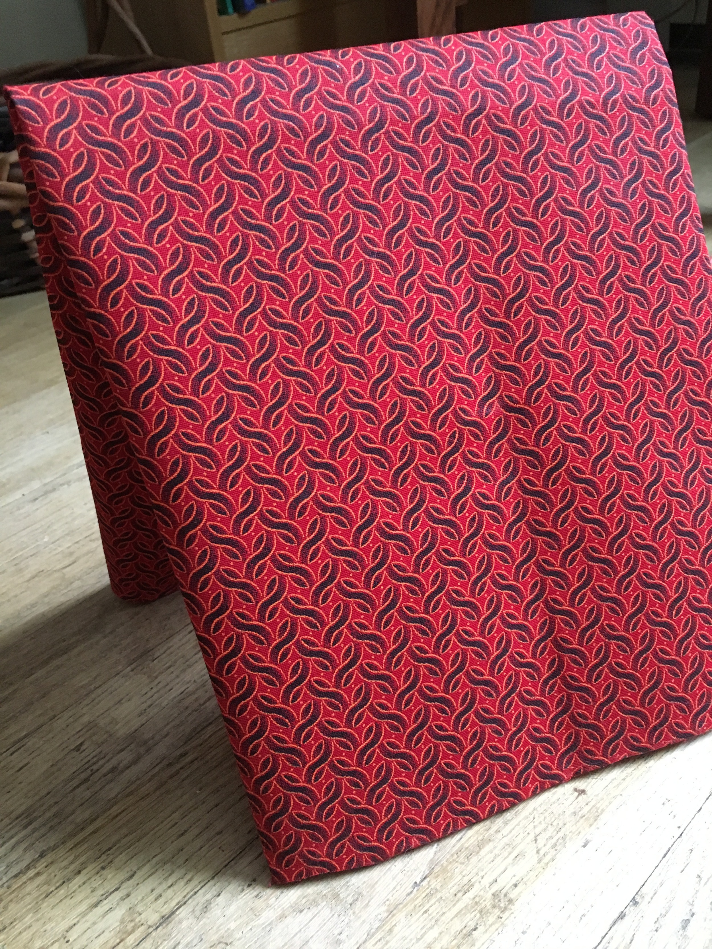 Shweshwe red and black fabric.jpg