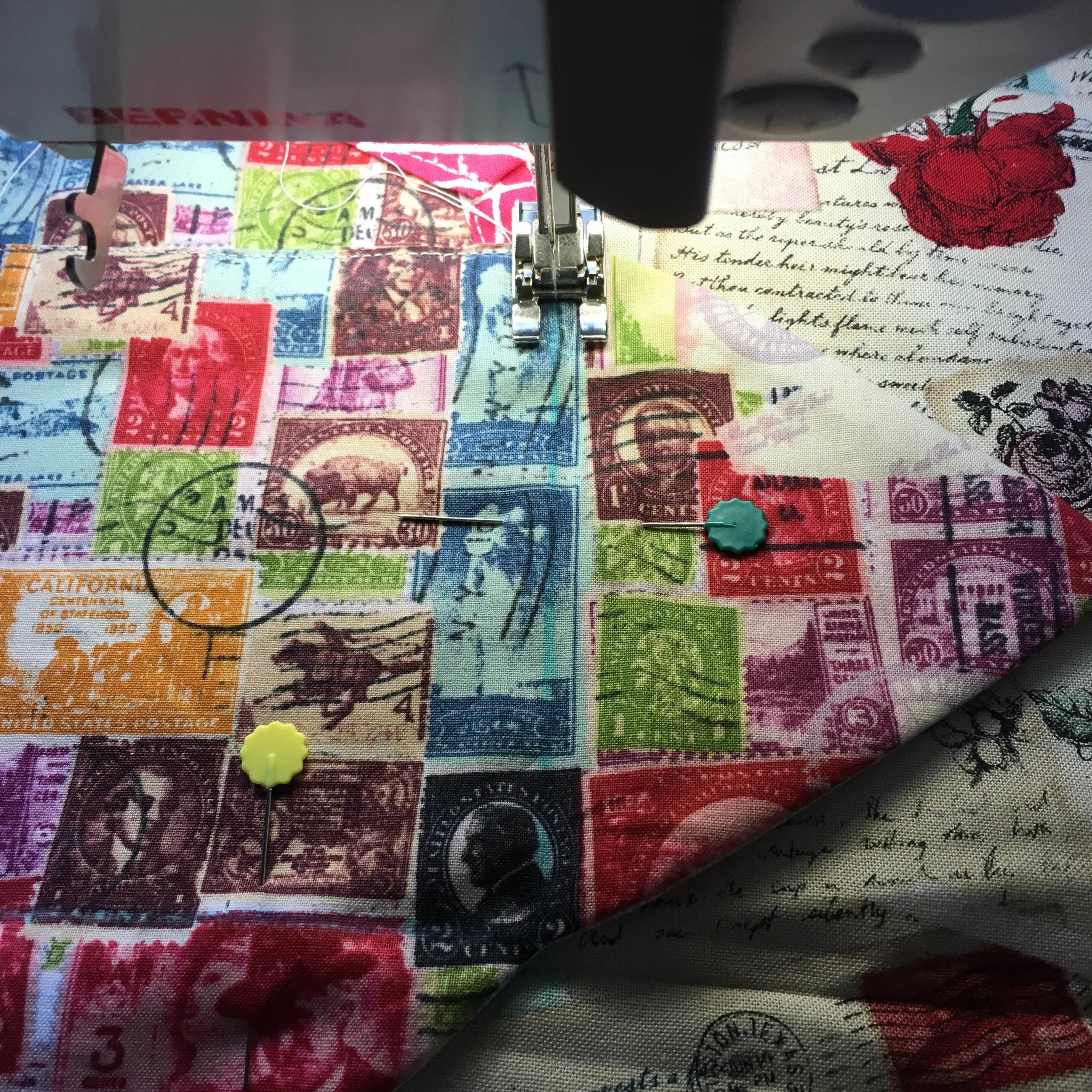 Sewing the flat, open envelope to front pillow panel. Note blue marking line, drawn along fold line of envelope body.