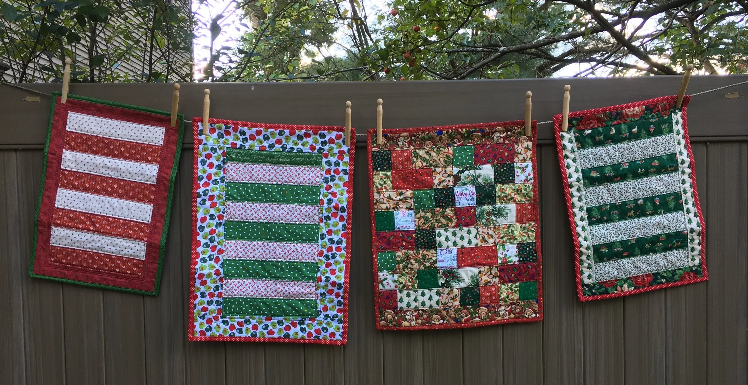 Doll Christmas quilts on the clothes line