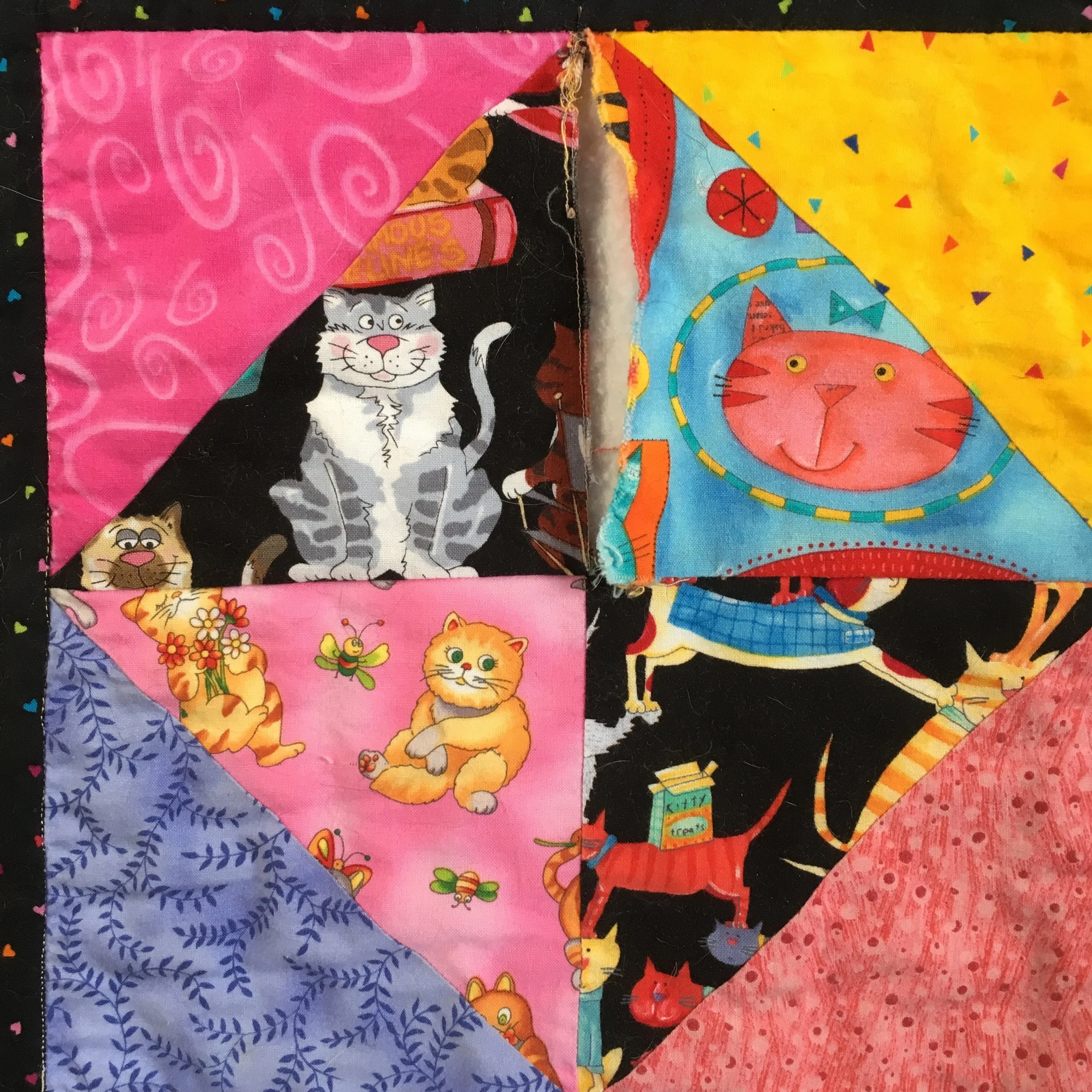 Separated seam in a quilt block, top center of the block.