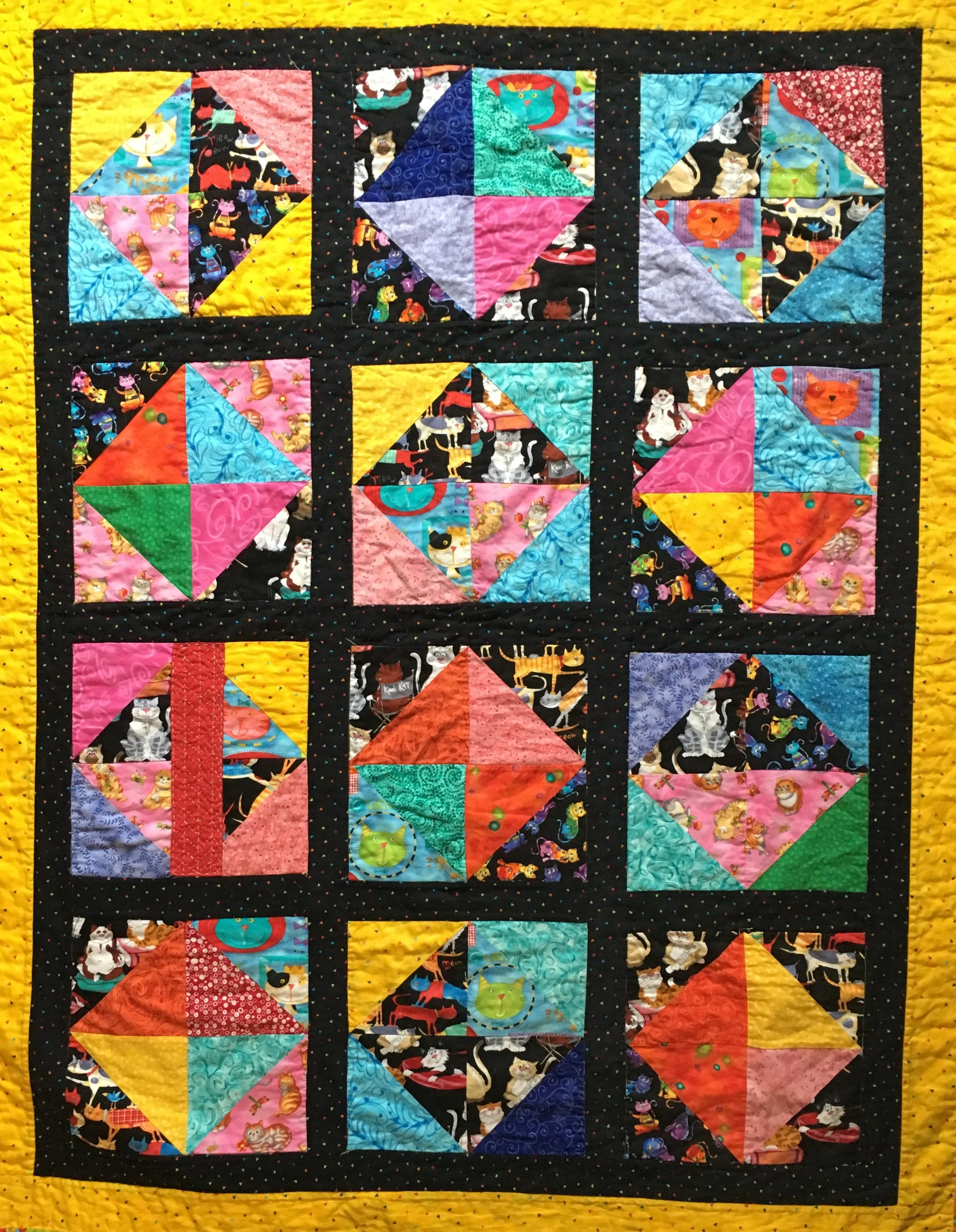 The sashiko mend plays happily with the blocks in this quilt. (Its in the far left rowd, 3rd block down).
