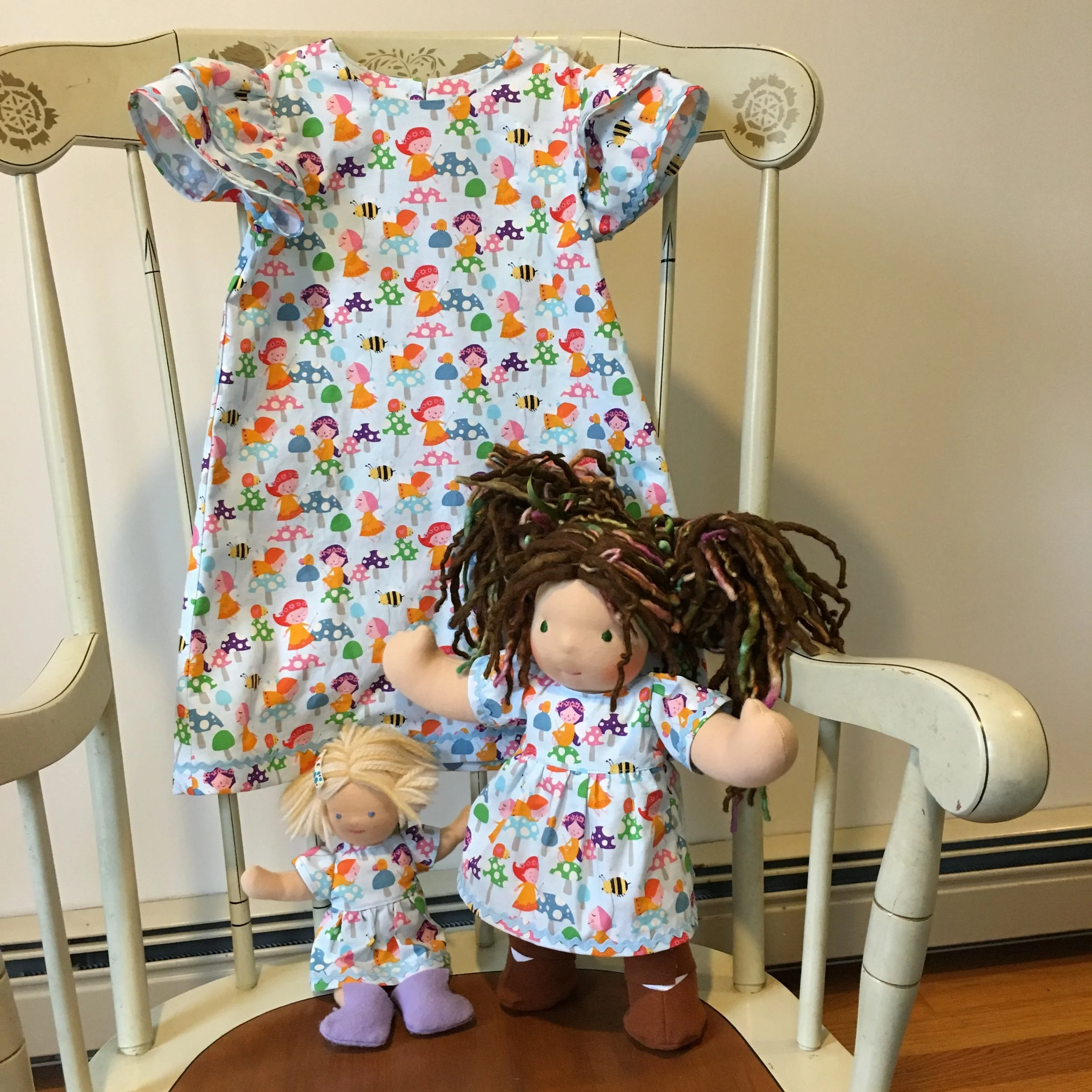 Child’s size 4 dress, Simplicity S8897. The dolls are wearing clothes I drafted.