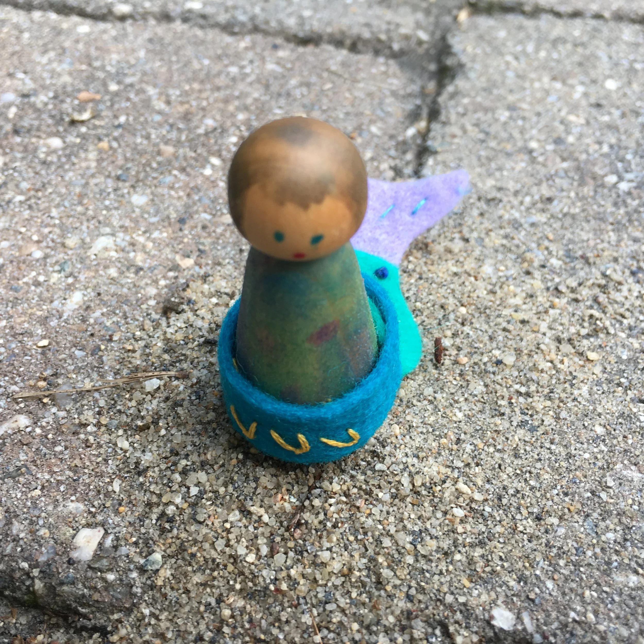 Here’s a mermaid with painted hair,. I think she is every bit as sweet as the mermaids with roving hair. And probably better for 3-5 year children.