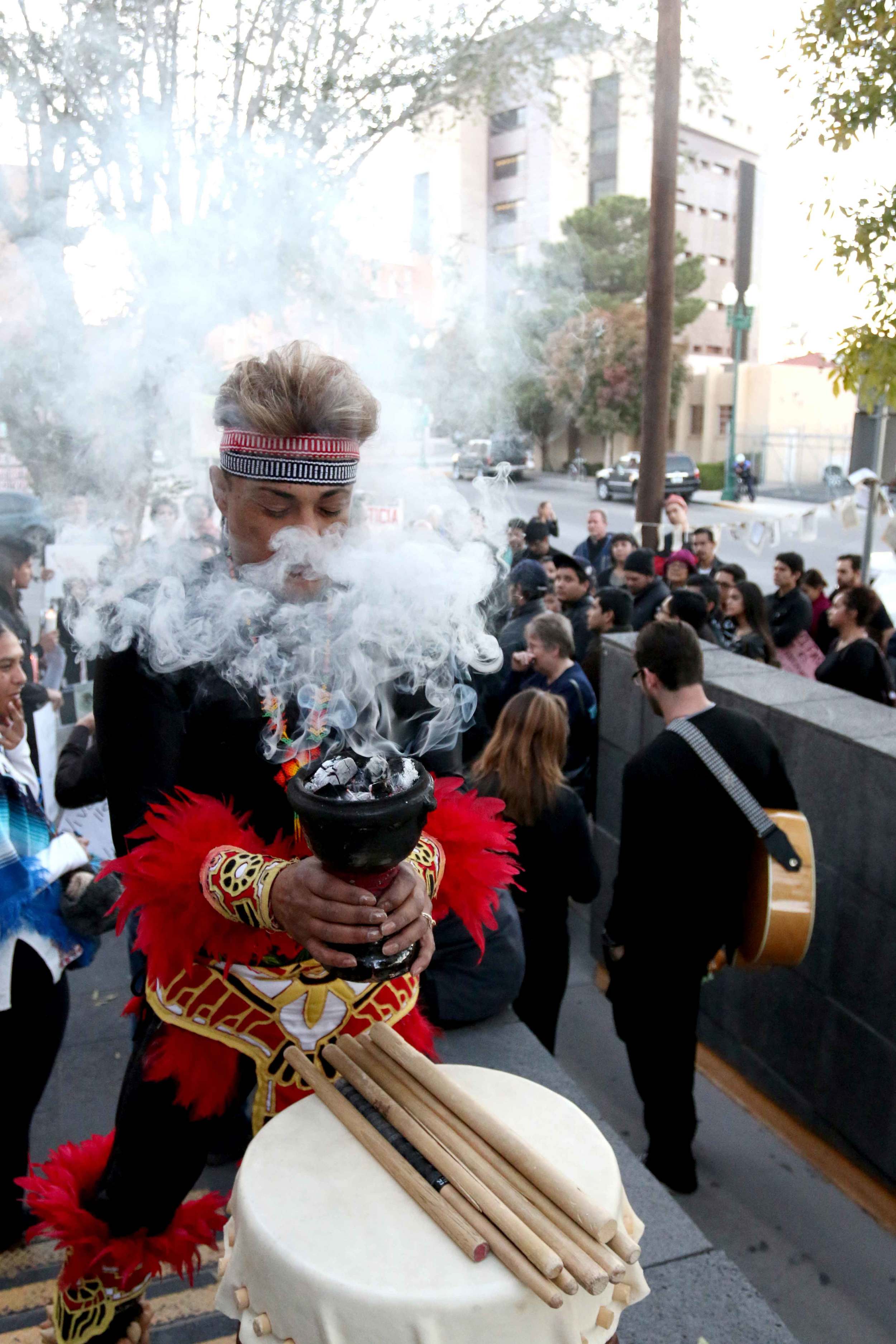 An El Pasoan performs a native ritual in front of the Consulate General of Mexico during a vigil for the 43 missing Ayotzinapa college students from Mexico on Nov. 21, 2014.