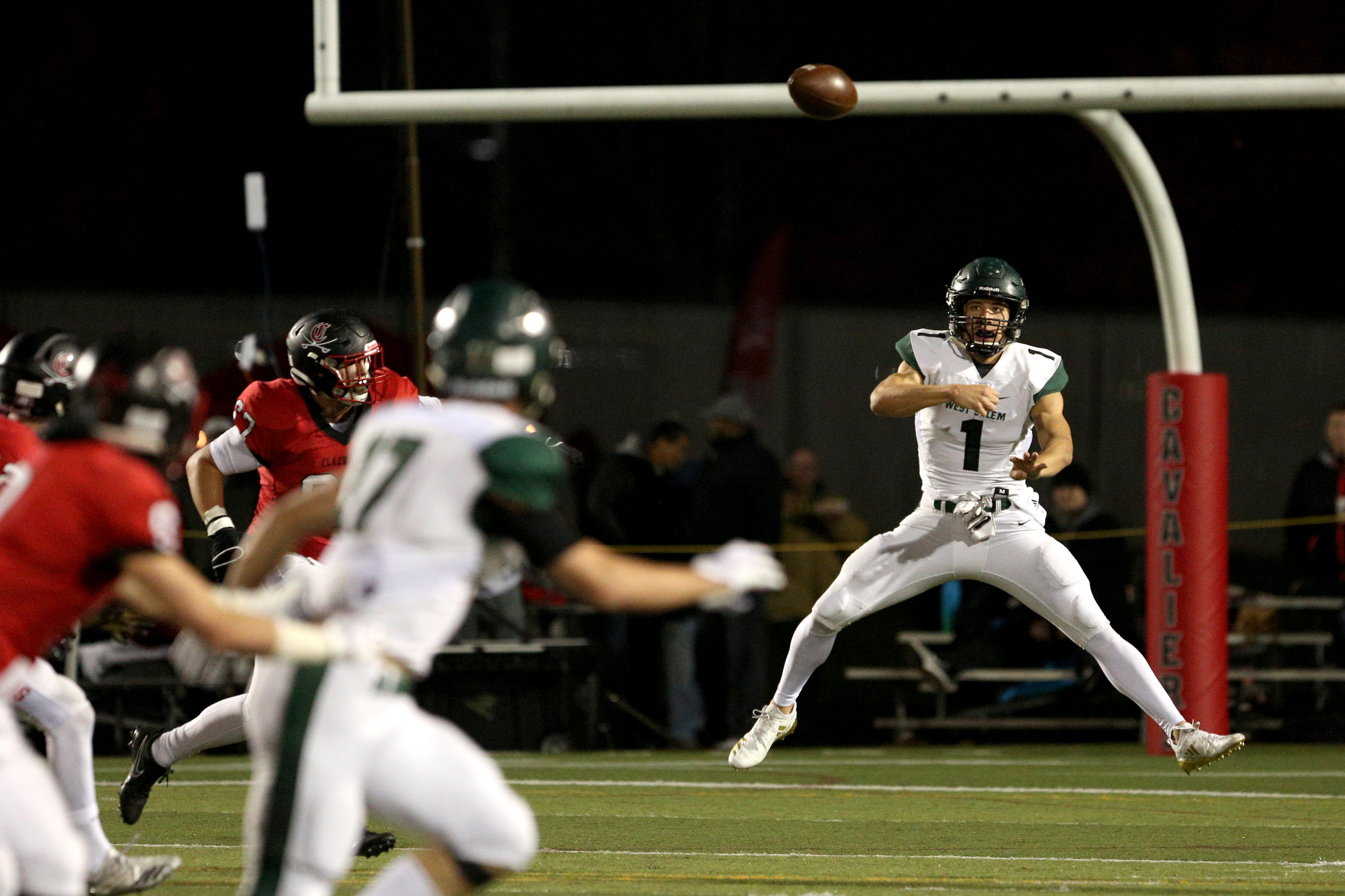 West Salem quarterback Simon Thompson makes a pass during the West Salem High School vs. Clackamas High School 6A playoff football game in Clackamas, Oregon on Friday, Nov. 9, 2018.
