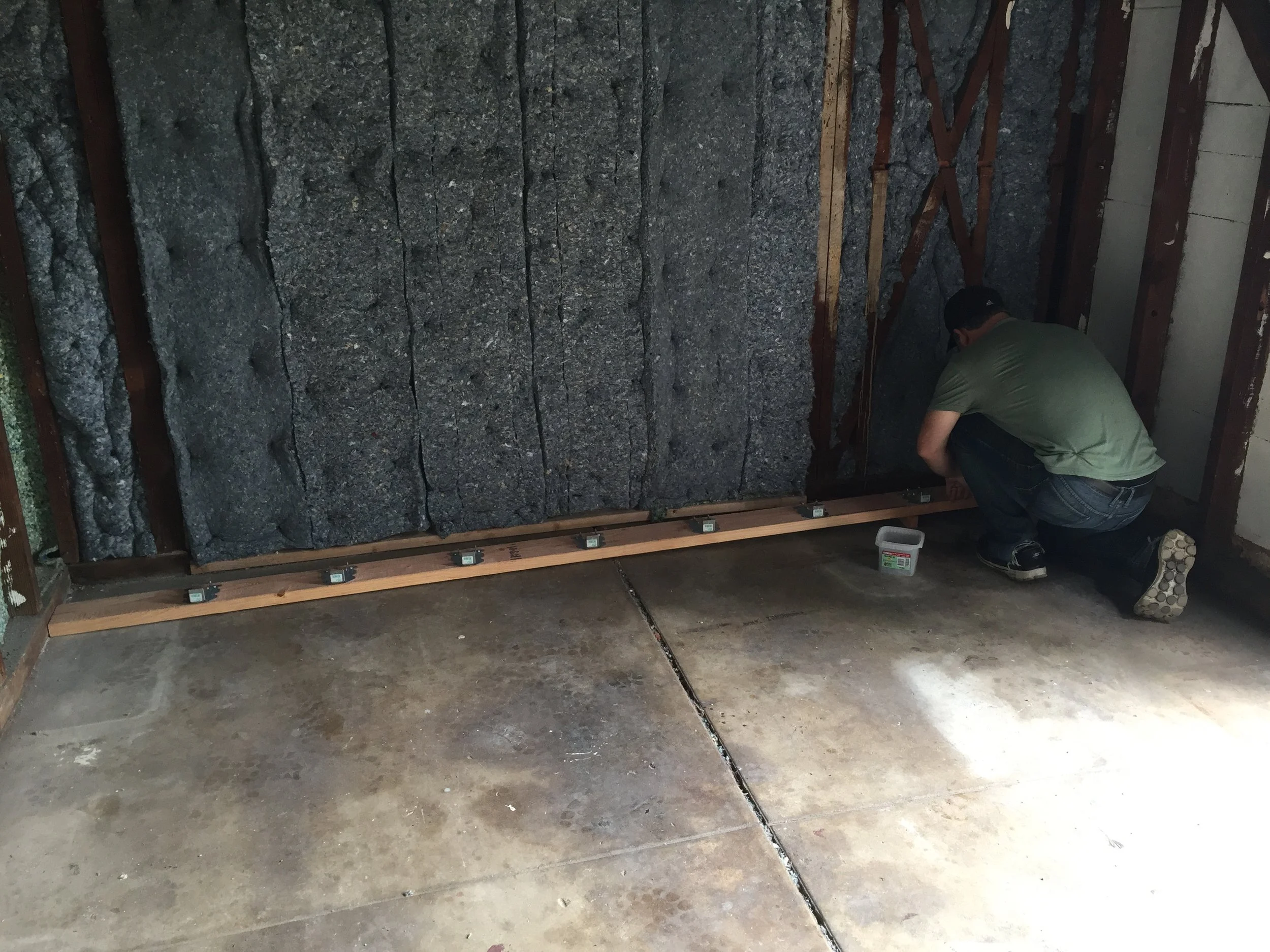 Installing hangers for the new floor joists