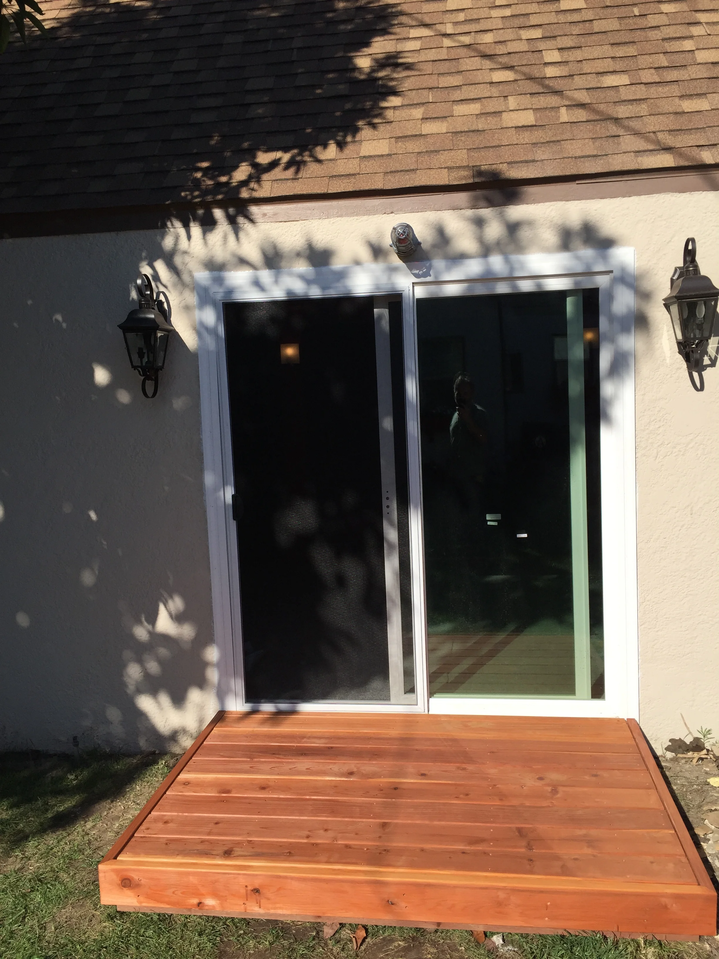 A little raised redwood deck to help keep the studio clean. Also we installed two lanterns and a red recording light above the doorway. 