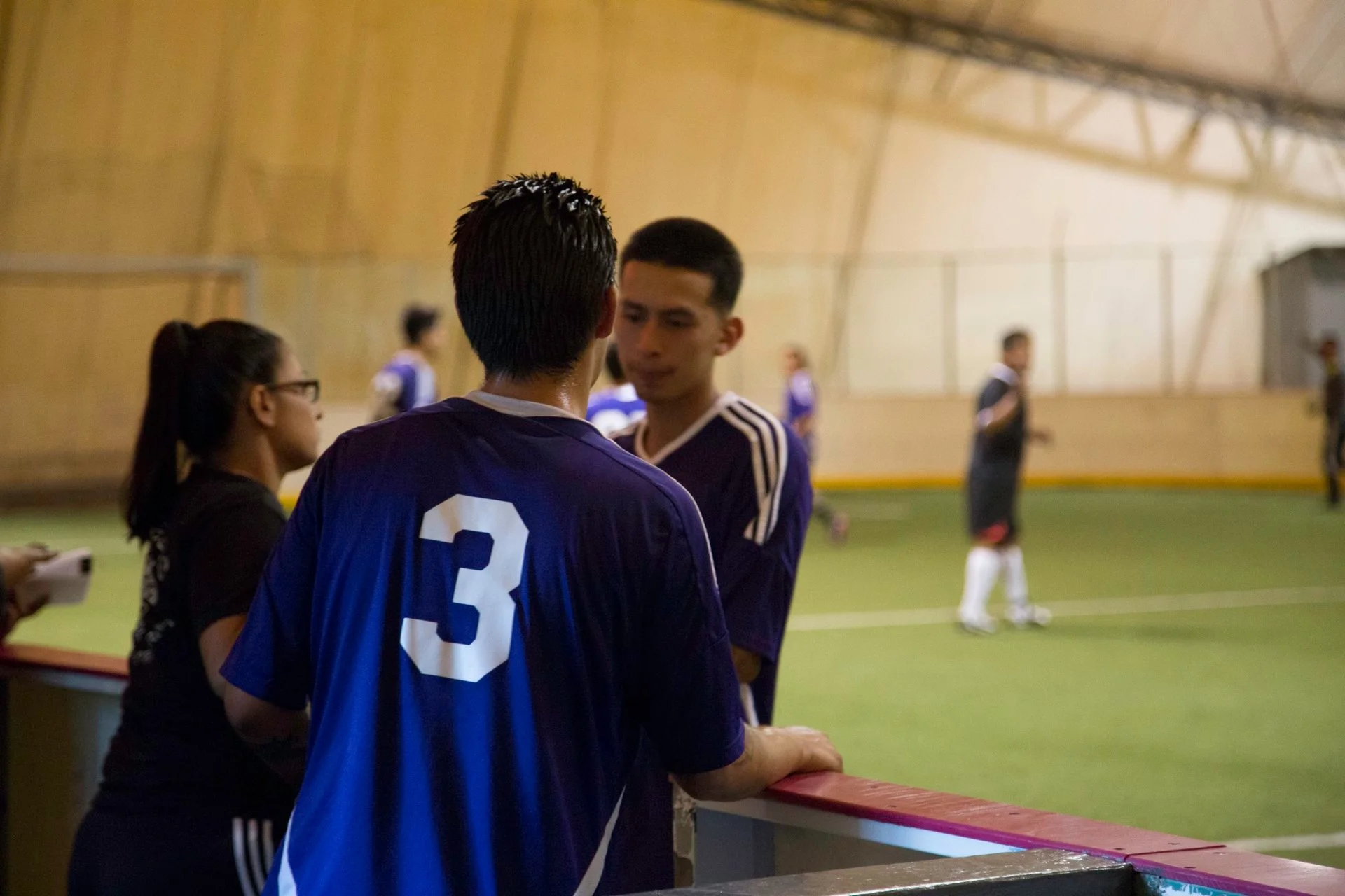 Gina coaching the Aztecas youth soccer players.