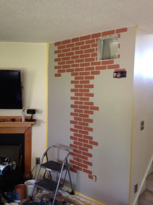 The grey base color painted and the beginning of painting the brick