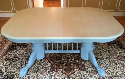 The dining table previously painted