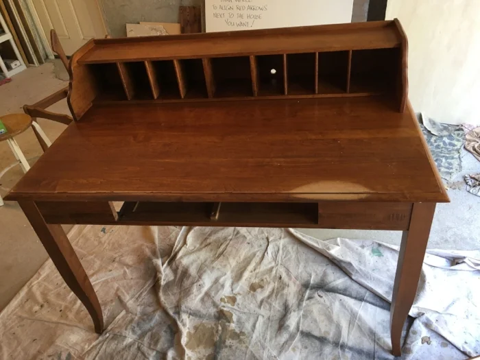 The desk before refinishing. I forgot to take a "before" shot of the chair (!), but you can just see the frame behind the desk
