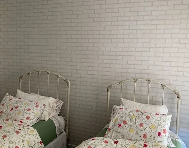 Faux whitewashed brick wall