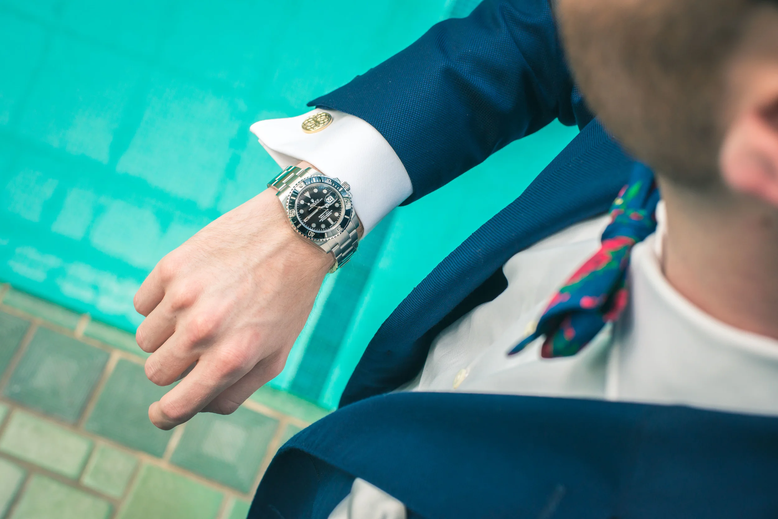 Watch: Rolex, Shirt: Ledbury, Suit: J. Lindeburg, Tie: The Tie Bar, Photo: Alec Hutchins Photography, Model: Noah Williams, Location: Reynolda House Museum of American Art historic indoor pool. 