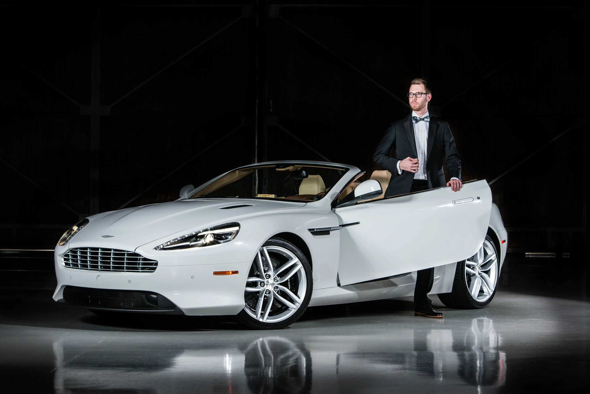 Tuxedo: Armani Collezioni, Shirt: Ledbury, Tie: The Tie Bar, Shoes: Crosby Square, Glasses: Burberry, Car: 2014 Aston Martin DB9 Volante(courtesy Foreign Cars Italia). Photo: Alec Hutchins Photography, Model: Noah Williams 