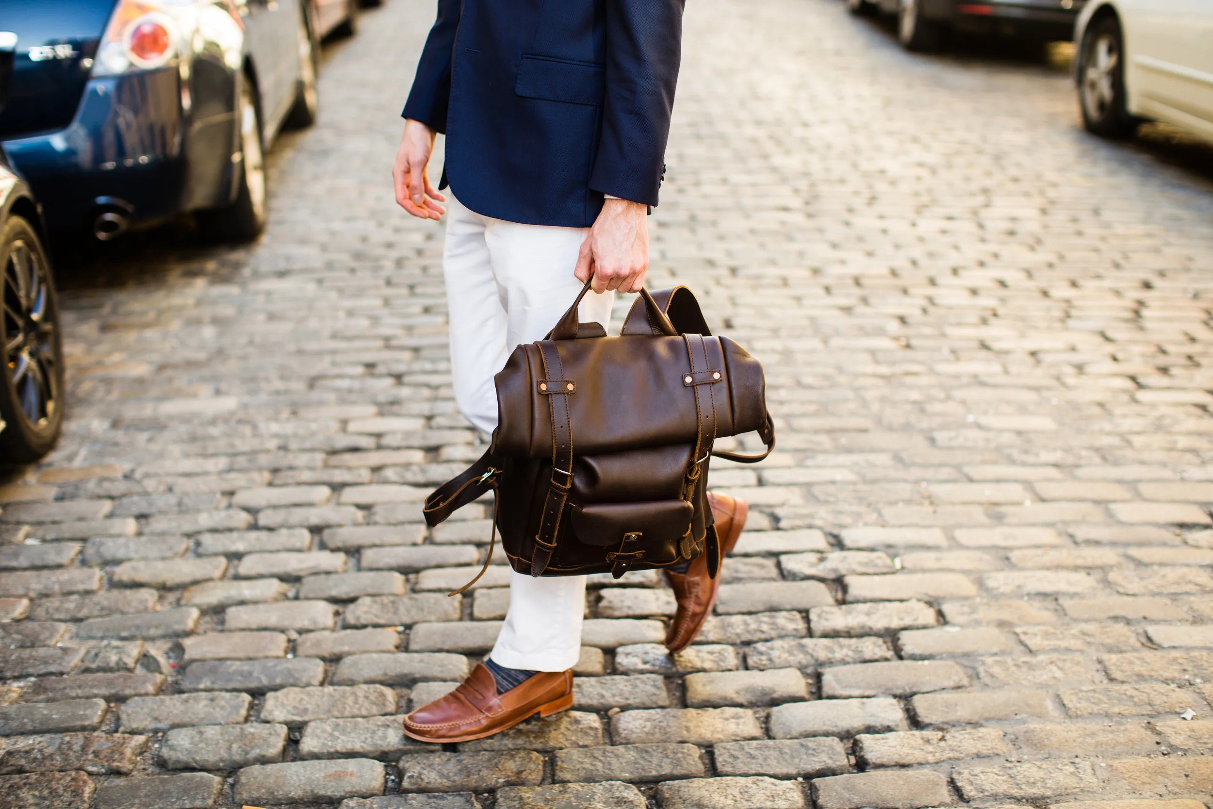 Suit jacket: J. Lindeburg. Pants: Banana Republic. Sweater: Jcrew. Shirt: Brooks Brothers. Pocket Square: Cotten Brew. Shoes: Johnston & Murphy. Glasses: Ralph Lauren. Bag: Pad & Quill