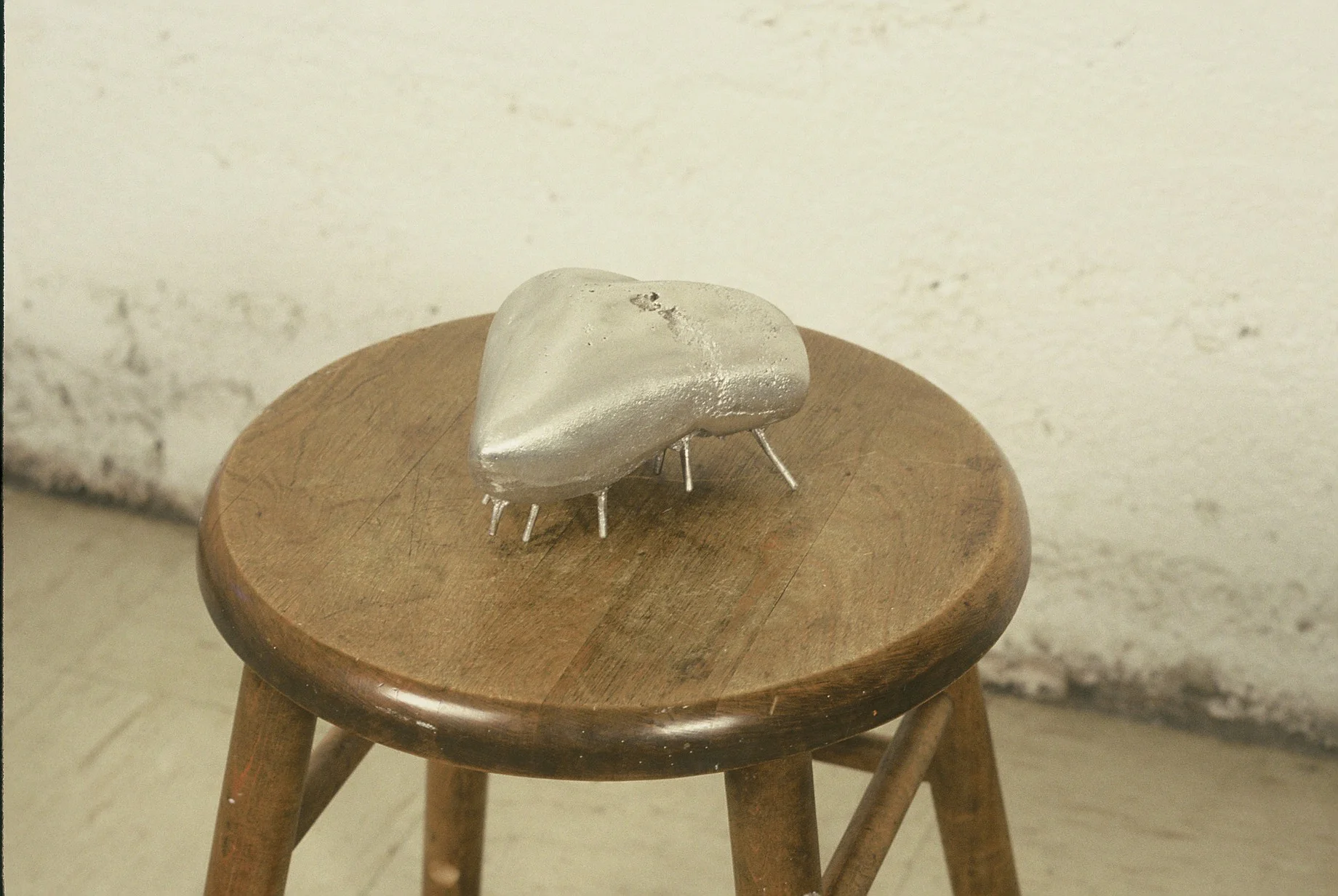  Untitled. 1996, cast aluminum , stool. 