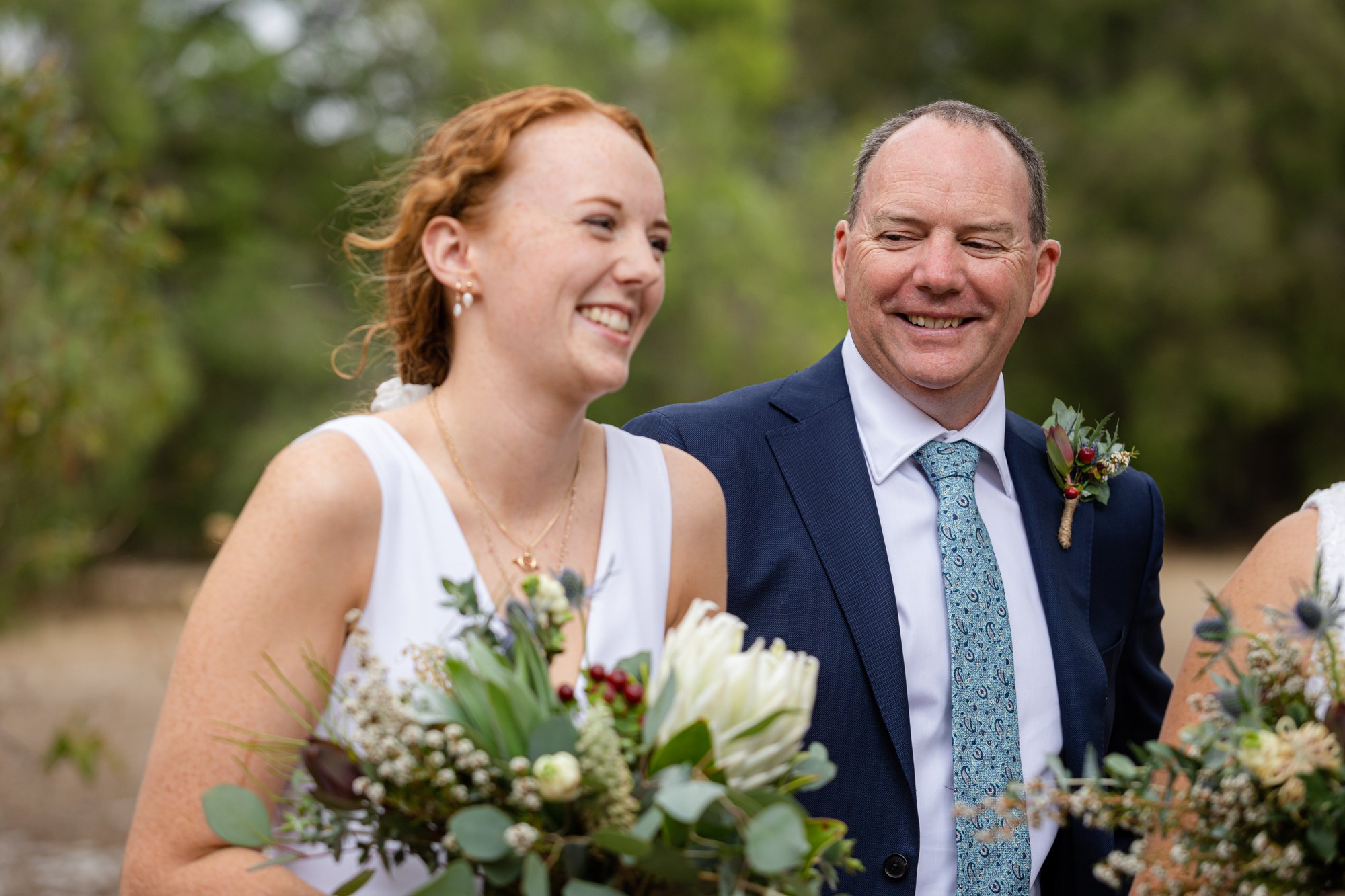 Woman holding white bouquet of flowers