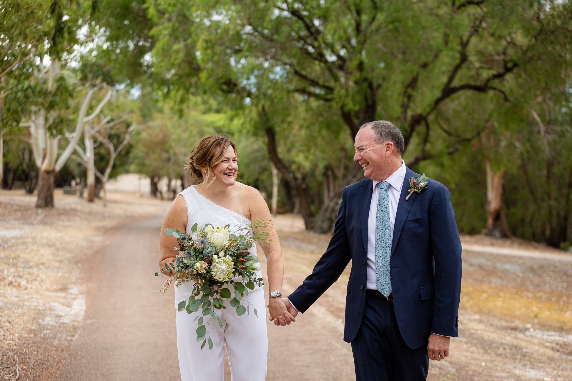 holding hands newly wed