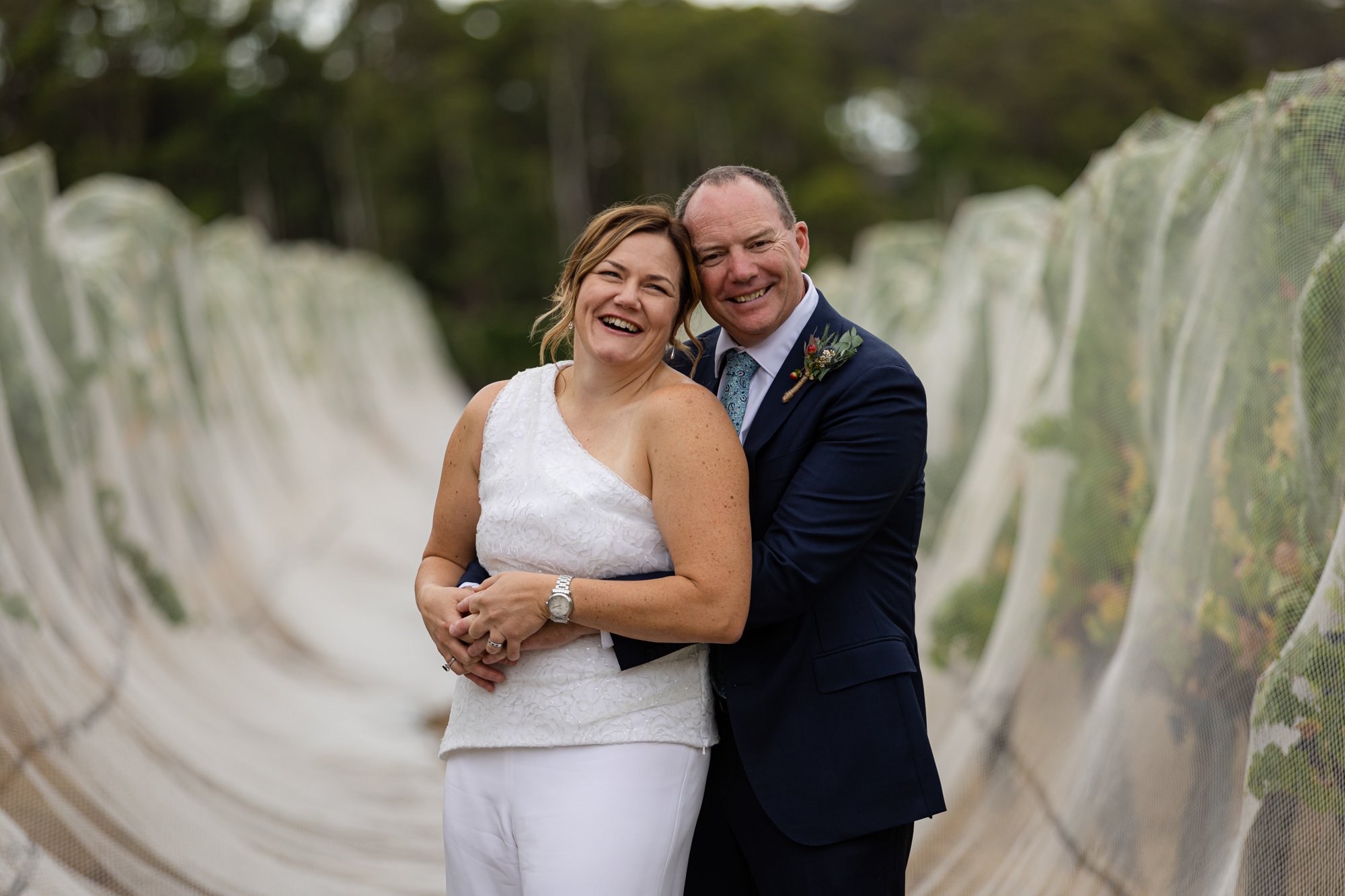 husband and wife smiling