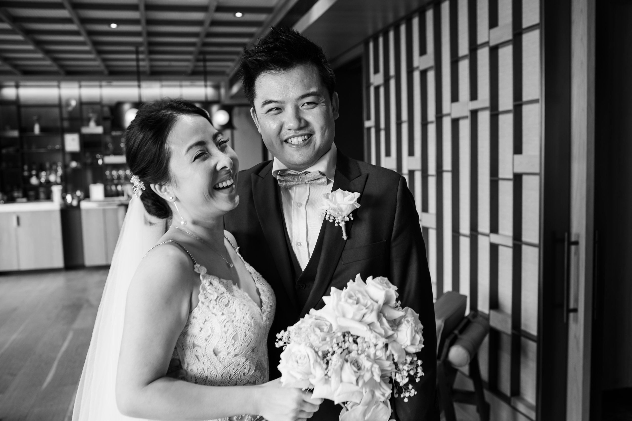 bnw bride holding bouquet with husband