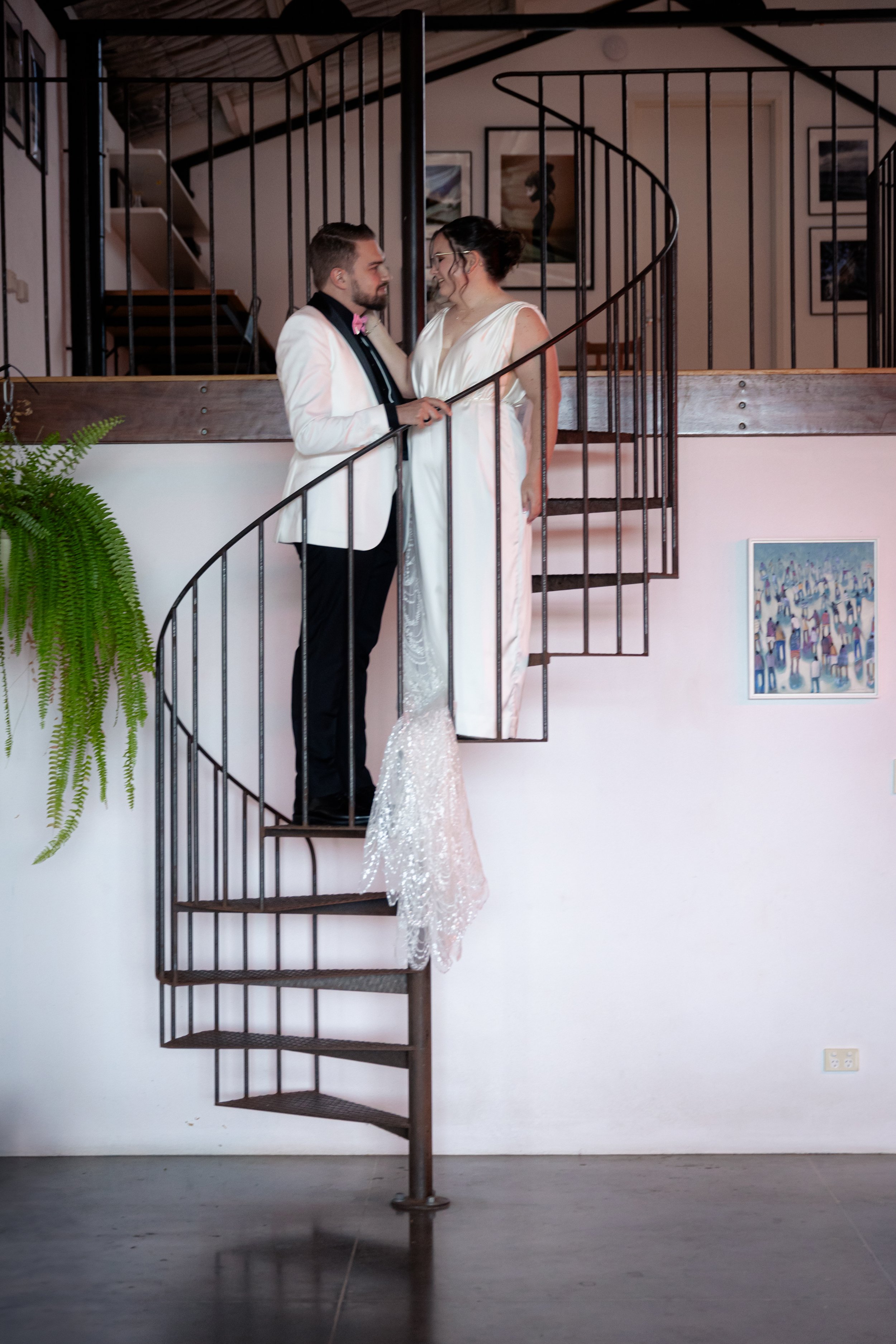 bride and groom at the staircase