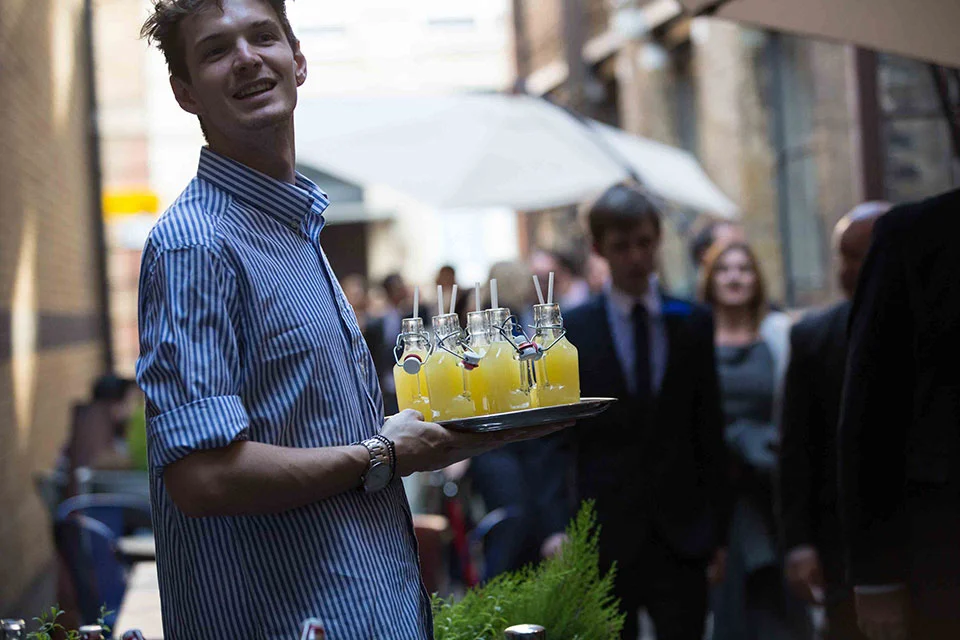 tanner warehouse, server serving drinks outside
