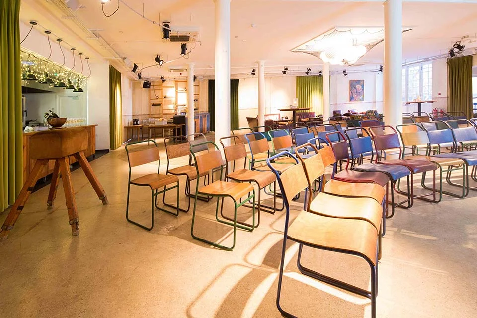 Tanner Warehouse interior, rows of seating set up for a meeting