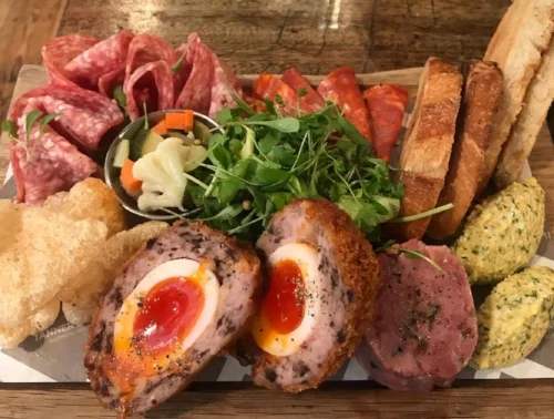 THE MEAT BOARD OF THE array of STARTERS TO SHARE.