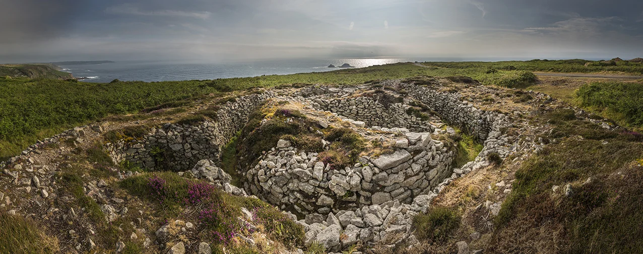 The barrow is situated near St. Just and Lands End is just visible to the left.