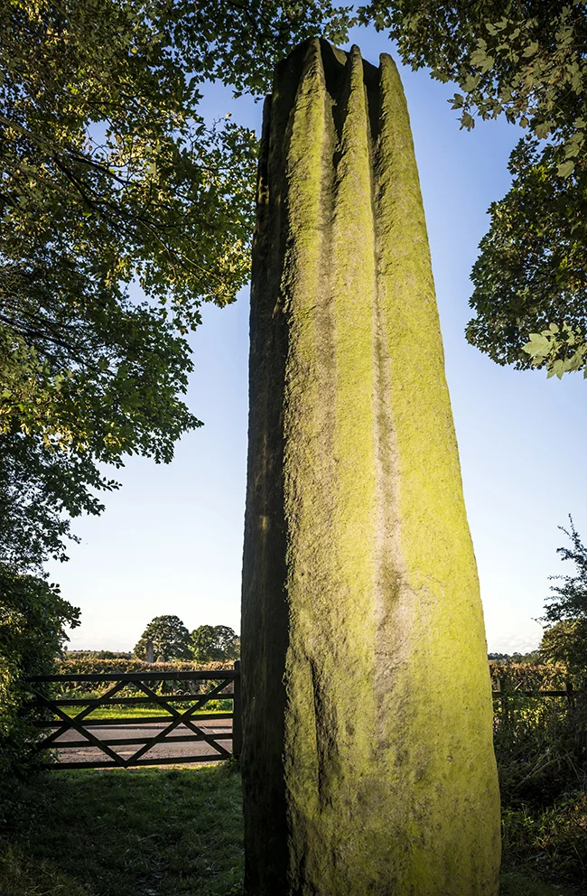 The third stone nestled in the trees and separated from it's kin by a small road