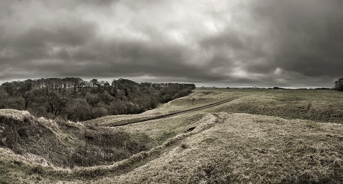 The hill fort was later adapted by the Normans who built a motte at the end of the spur. This is the view South East from the motte. (Note later quarrying in the left foreground).