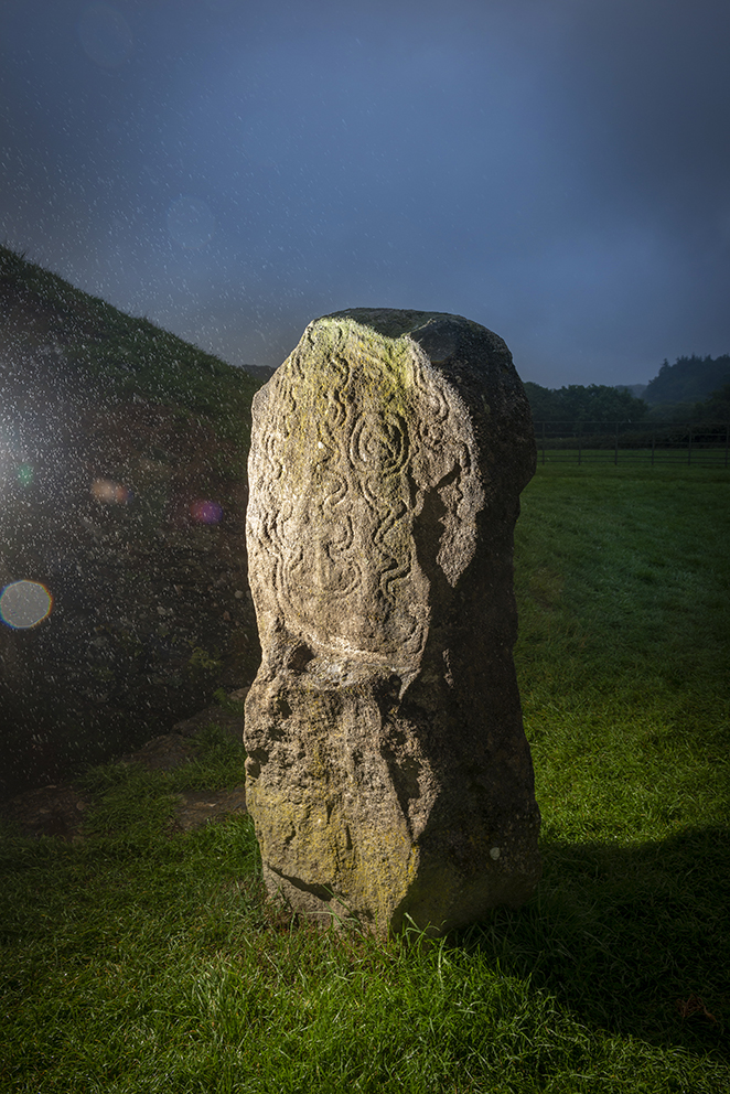 the standing stone with the zig-zagging artwork. This is a replica and the original is in the National Museum of Wales