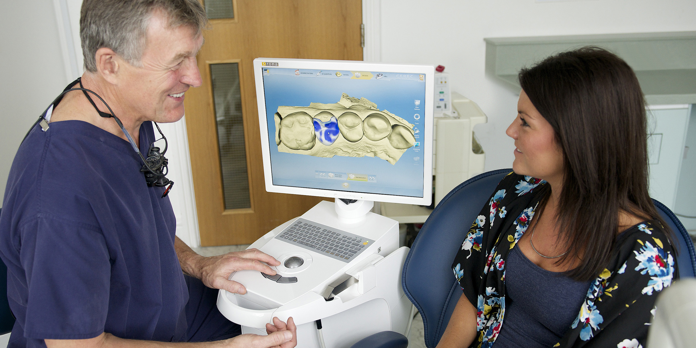 Rob discussing a CEREC treatment with a patient.