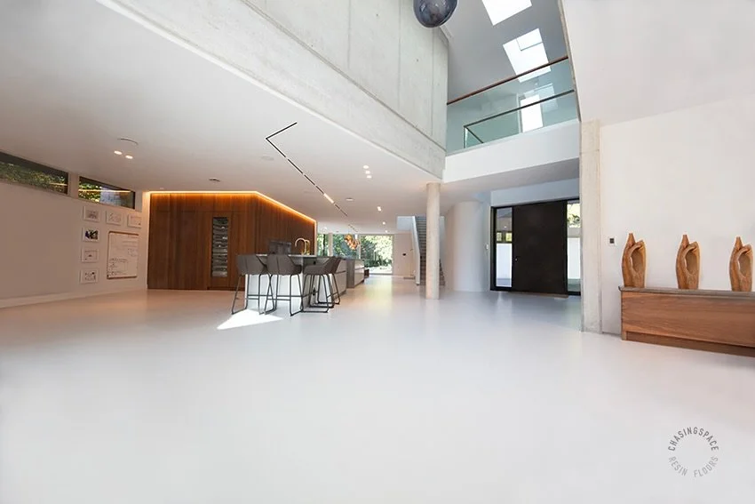 Our PU Comfort Floor installation covering the main living area of an expansive modern home in Dorset. The grey floor has transformed the interior, with a luxurious finish that beautifully reflects the ambient light.
Please get in touch to see how w