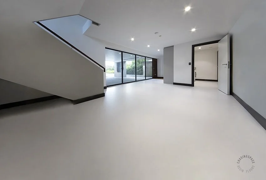 Open ground floor area with our durable PU Comfort Floor in Steam colour. The floor creates a striking entrance space, reflecting modern, minimalist design.
Resin Floors by Chasingspace, London
www.chasingspace.co.uk 
Call 07799 673383 + 020 8265 2