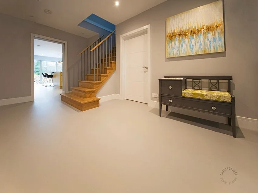 Neutral-toned PU comfort flooring has transformed the hallway into a bright, welcoming space. This installation is part of a ground floor makeover spanning 109m2 for our clients in Tewin. 

👉 www.chasingspace.co.uk&nbsp;
Call 07799 673383 + 020 8265