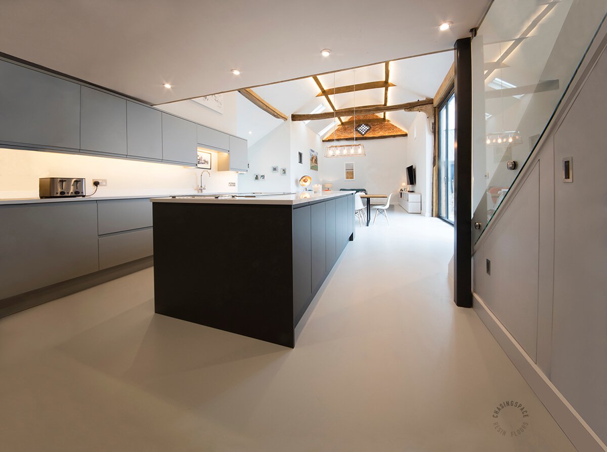 High-quality, durable resin floor installation within a contemporary barn interior.