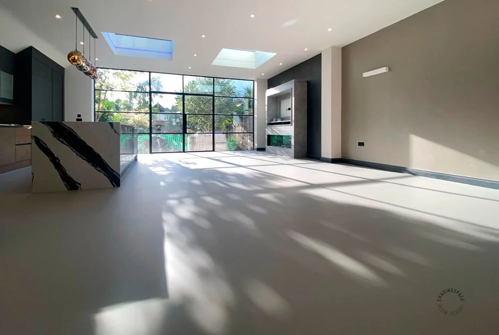 Seamless interior space features smooth, durable resin flooring.