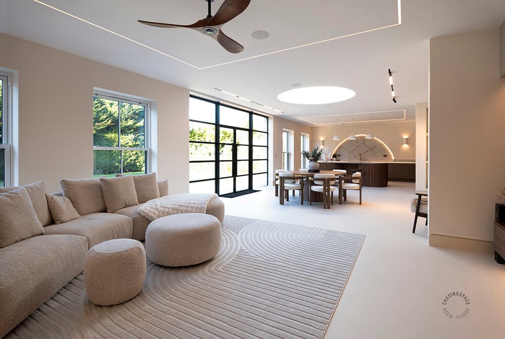 A contemporary lounge/dinner in neutral tones benefits from a chic polyurethane floor, by residential flooring experts Chasingspace.