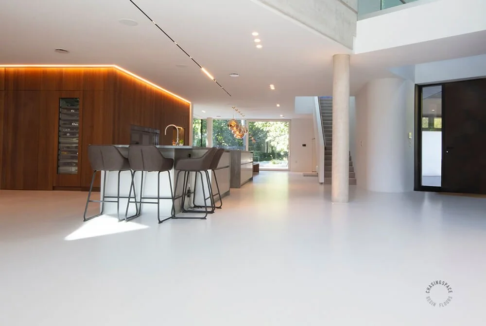Resin kitchen floor in an airy, modern, Chasingspace UK Resin Flooring property.